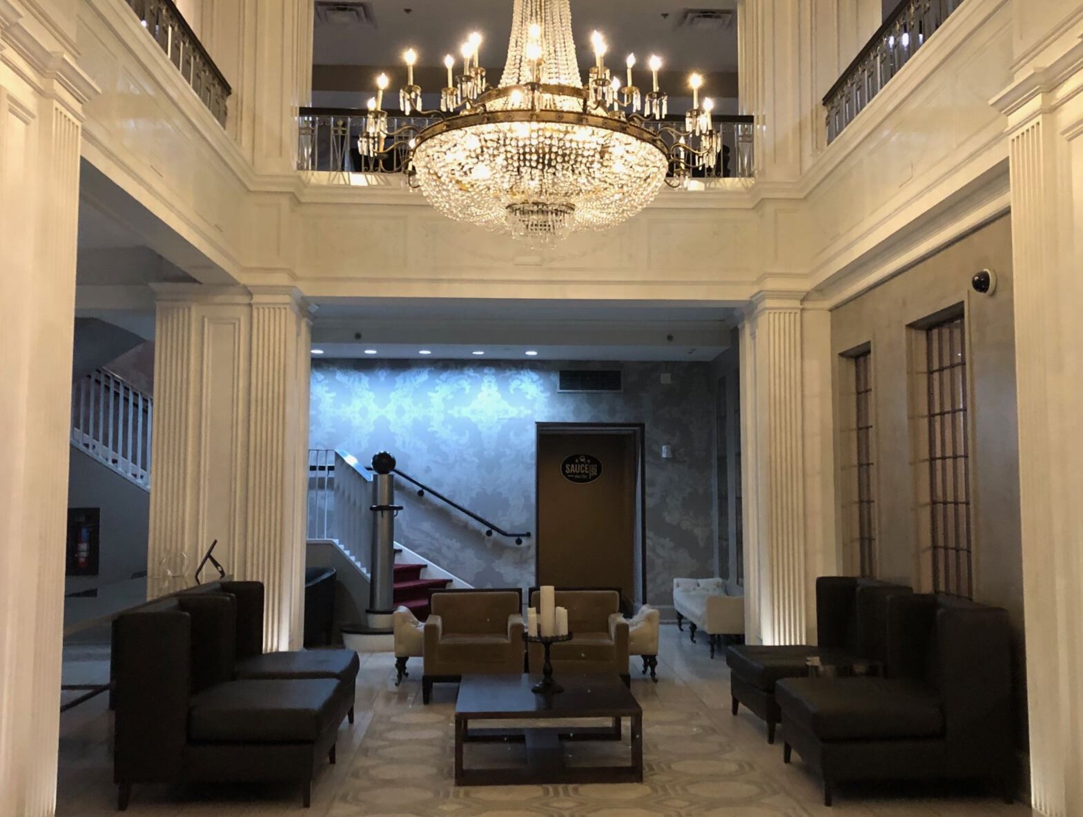 Stately lobby of the Magnolia Hotel with chandelier